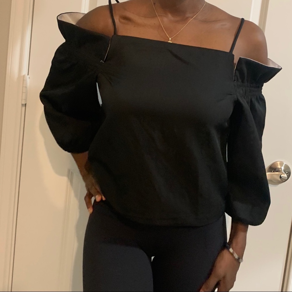 Say what ? Black off shoulder top.